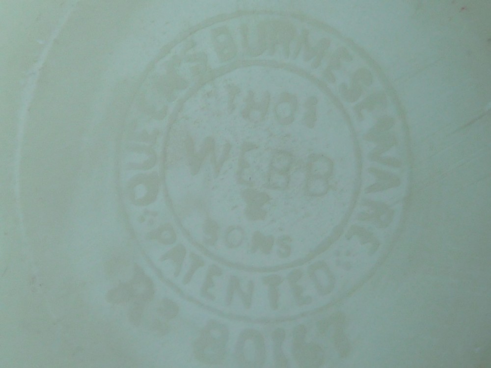 A small Victorian Burmese satin glass vase with a crimped rim, shading from yellow at the base to pink at the top, decorated with hand-painted leaves and berries. View VI