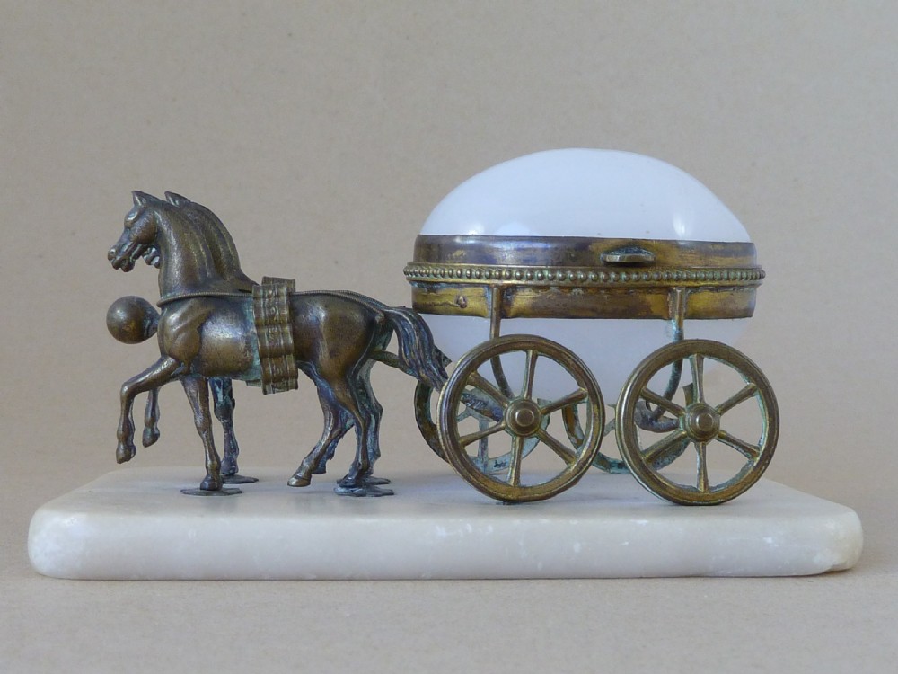 A French Palais Royal style miniature horse-drawn carriage featuring a white opaline glass egg-shaped casket mounted on a gilt metal frame and alabaster base. View II