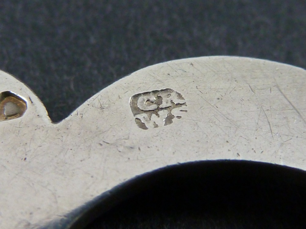 Victorian solid silver decanter label formed as an engraved cut-out monogram letter with a silver suspension chain. View V