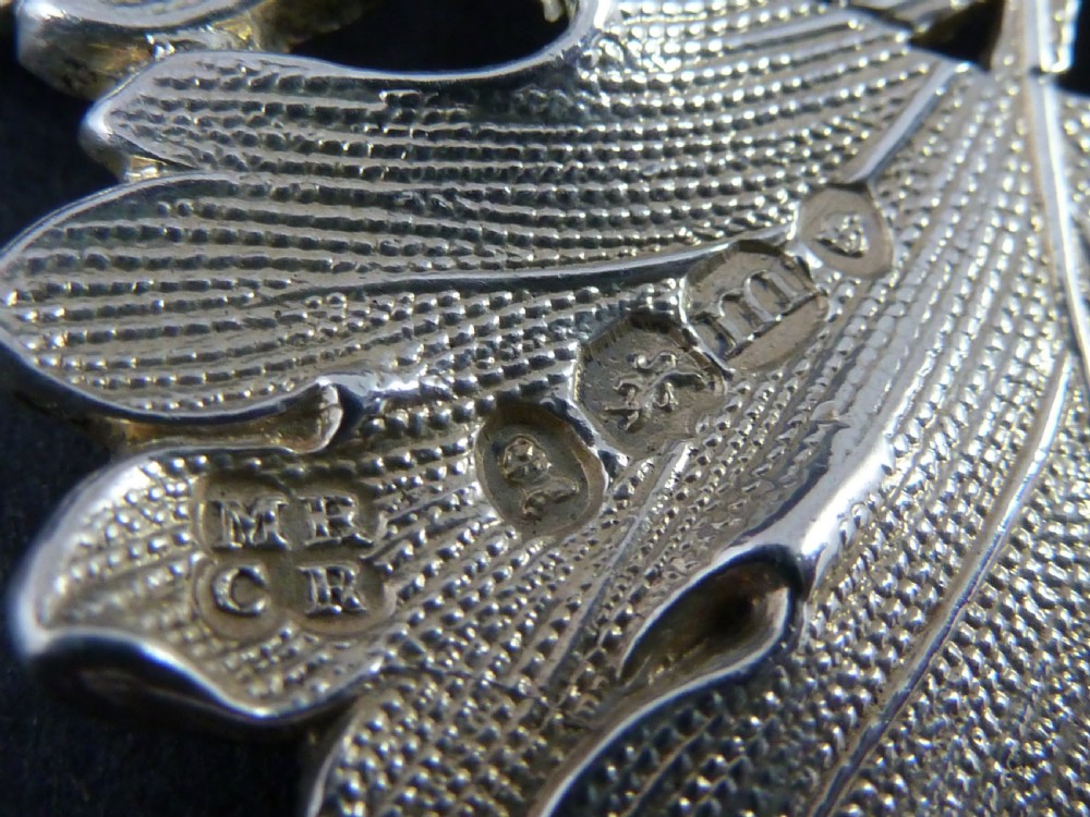 A George IV sterling silver decanter label shaped as a detailed vine leaf with pierced lettering reading SHERRY and attached suspension chain. View III