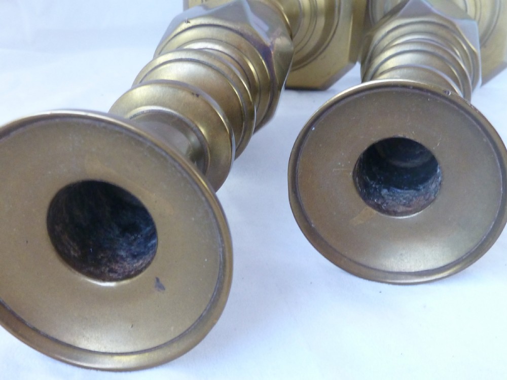 A pair of 14-inch Victorian cast brass candlesticks featuring faceted diamond-shaped centre knops and octagonal stepped bases. View V