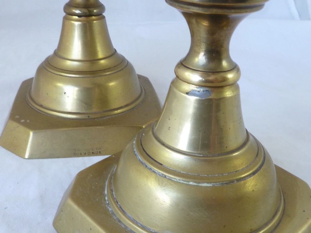A pair of 14-inch Victorian cast brass candlesticks featuring faceted diamond-shaped centre knops and octagonal stepped bases. View VIII