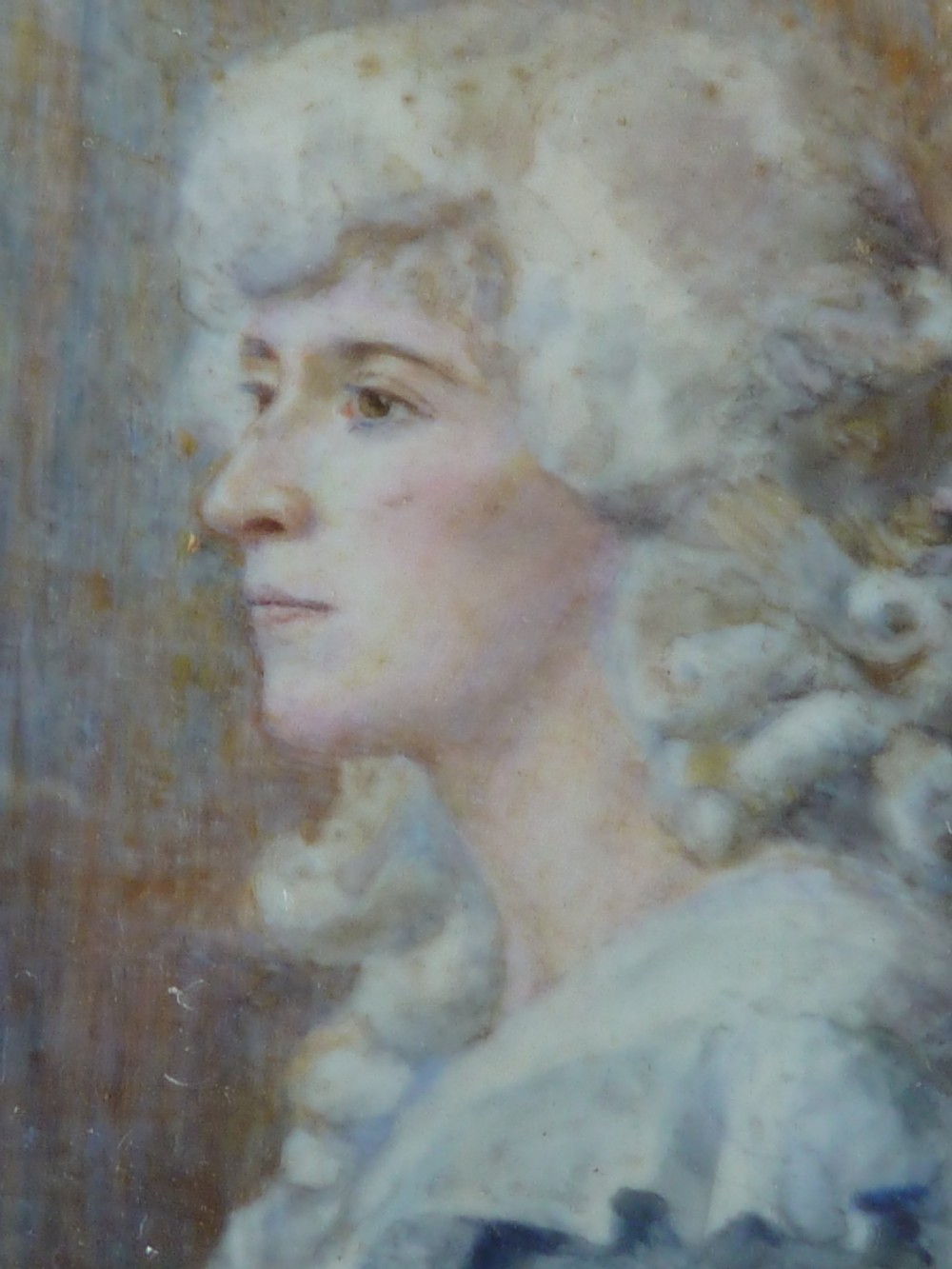 A profile portrait miniature painting of a lady in an eighteenth-century style powdered wig and ruffled blue dress, signed and dated 1914. View IV
