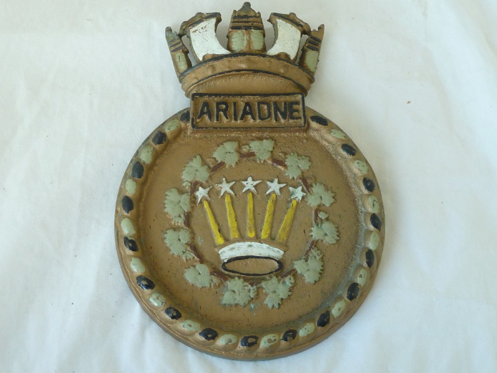 A circular cast bronze Royal Navy ship crest for HMS Ariadne featuring a naval crown top and rope border.