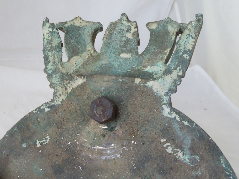 A circular cast bronze Royal Navy ship crest for HMS Ariadne featuring a naval crown top and rope border. View III
