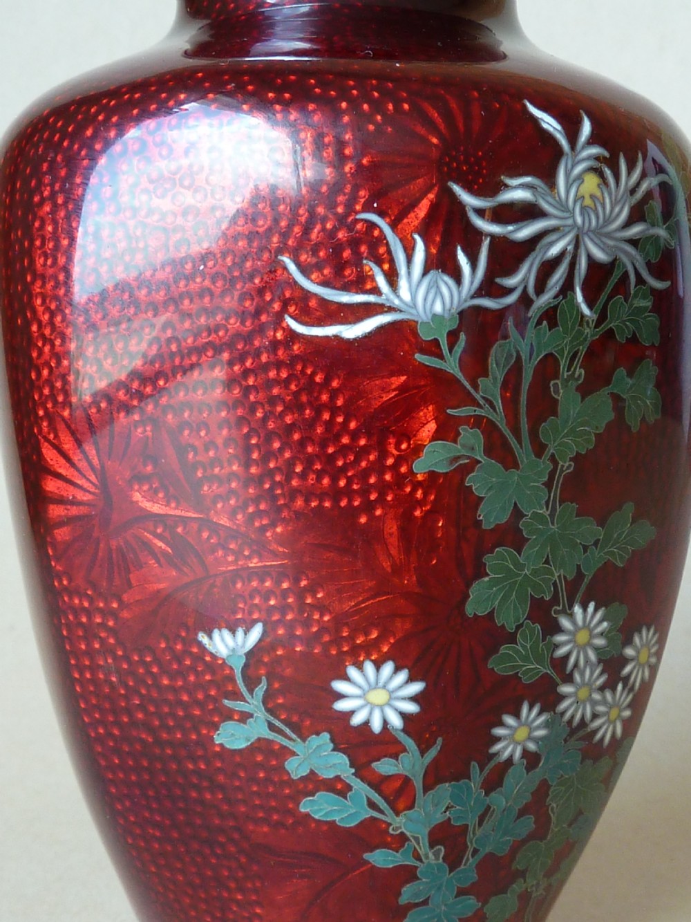 A crimson red translucent enamel vase decorated with silver wire chrysanthemums and silver rims. View V