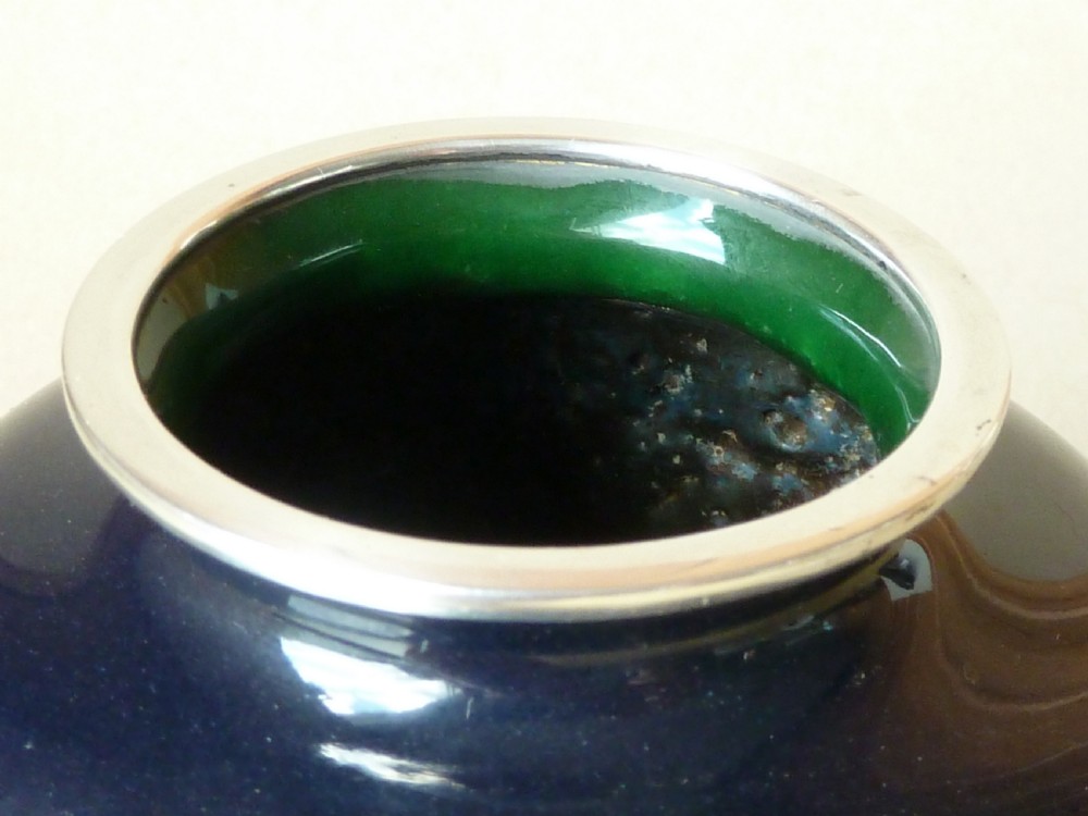A black Japanese cloisonne enamel vase decorated with silver wire depicting white blossoms, foliage, and birds, finished with silver rim and foot rim. View VI