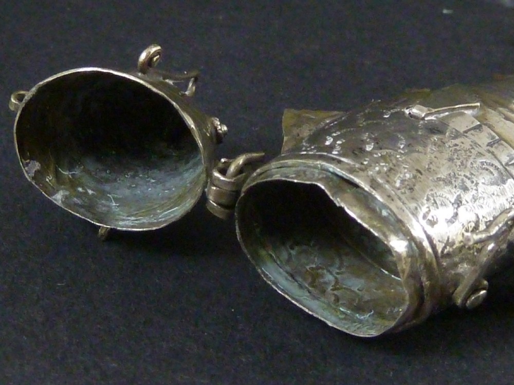 An articulated silver spice box crafted in the form of a detailed fish with overlapping scales and fins. View VI