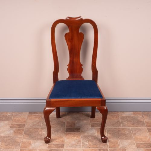 fig 1. A small mahogany childs chair featuring a vasiform back splat, cabriole front legs, and a dark blue velvet drop-in seat.