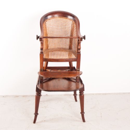 fig 2. A 19th-century childs tub high chair crafted from rich mahogany with woven cane panelling and turned front legs.