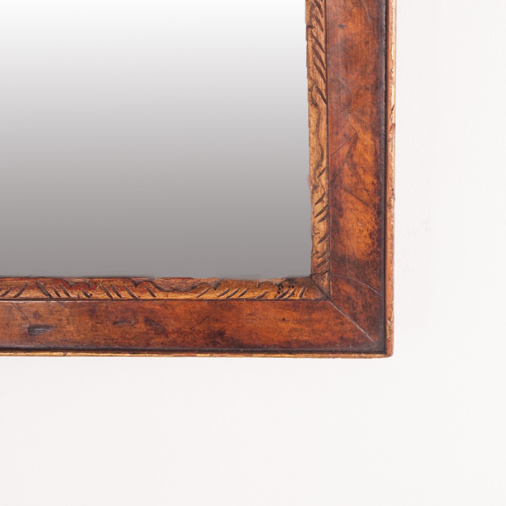 A rectangular walnut wall mirror with a contoured pediment top featuring a hand-carved shell motif. View V