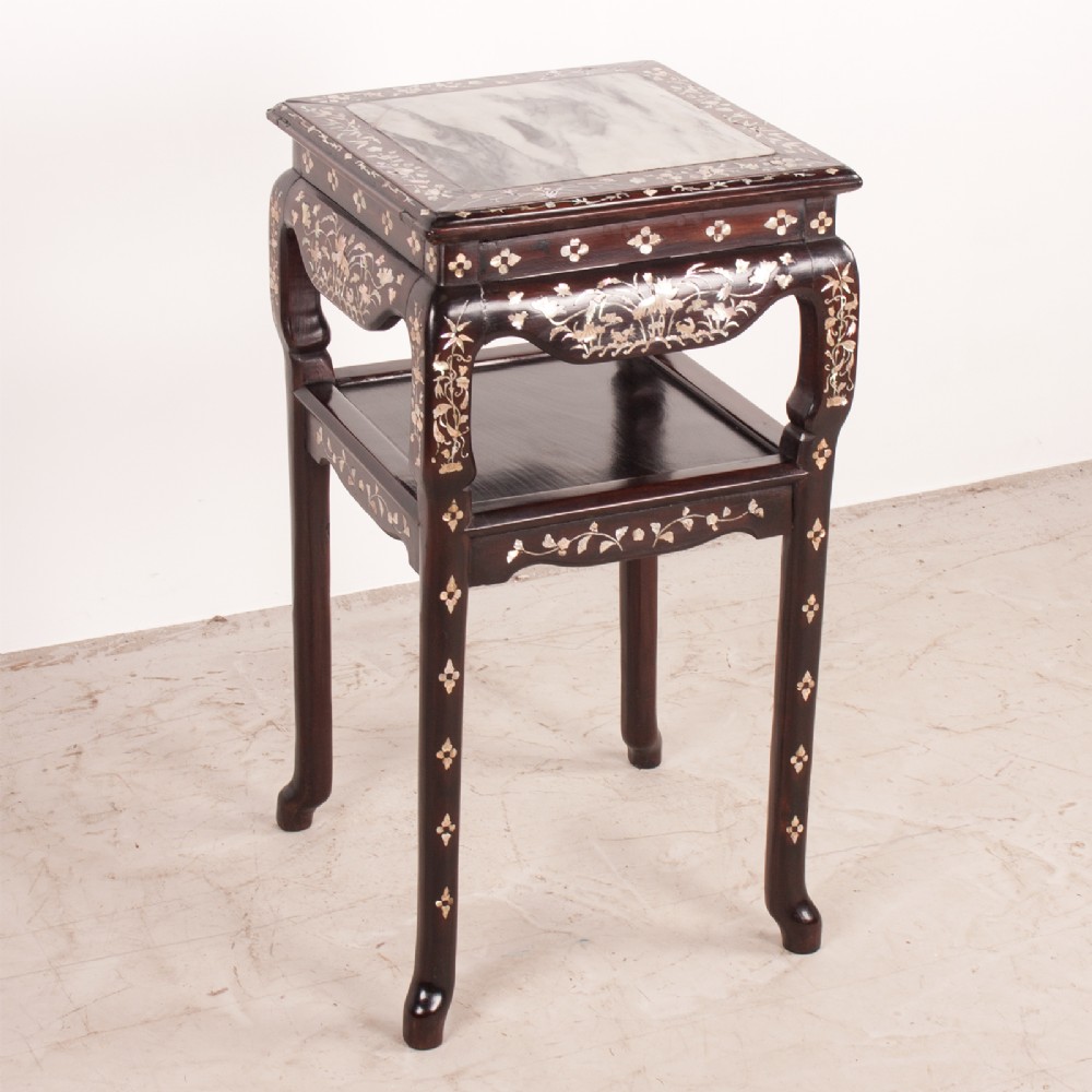 A square dark timber Chinese occasional table with mother-of-pearl inlay, a lower tier, and an inset grey marble top.