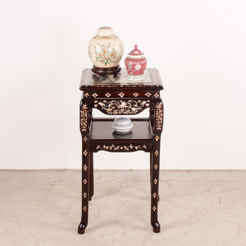 A square dark timber Chinese occasional table with mother-of-pearl inlay, a lower tier, and an inset grey marble top. View II