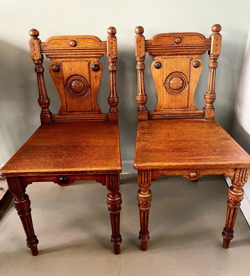 an antique pair of honey oak aesthetic movement hall chairs - CATEGORY: ANTIQUE CHAIRS - DATED 19TH CENTURY