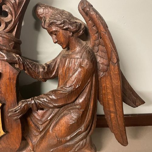 A 19TH OAK CARVING OF TWO ANGELS HOLDING ALOFT THE MONOGRAM OF CHRIST - ADDITIONAL PHOTO 2