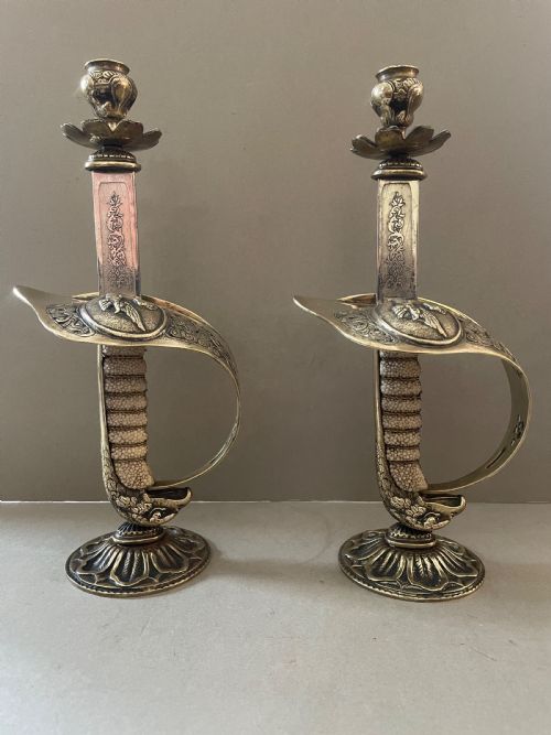 an antique pair of sword candlesticks - CATEGORY: ANTIQUE LIGHTING - DATED 19TH CENTURY