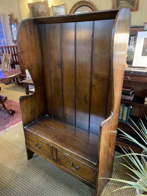 an antique pine settle - CATEGORY: ANTIQUE FURNITURE - DATED 19TH CENTURY