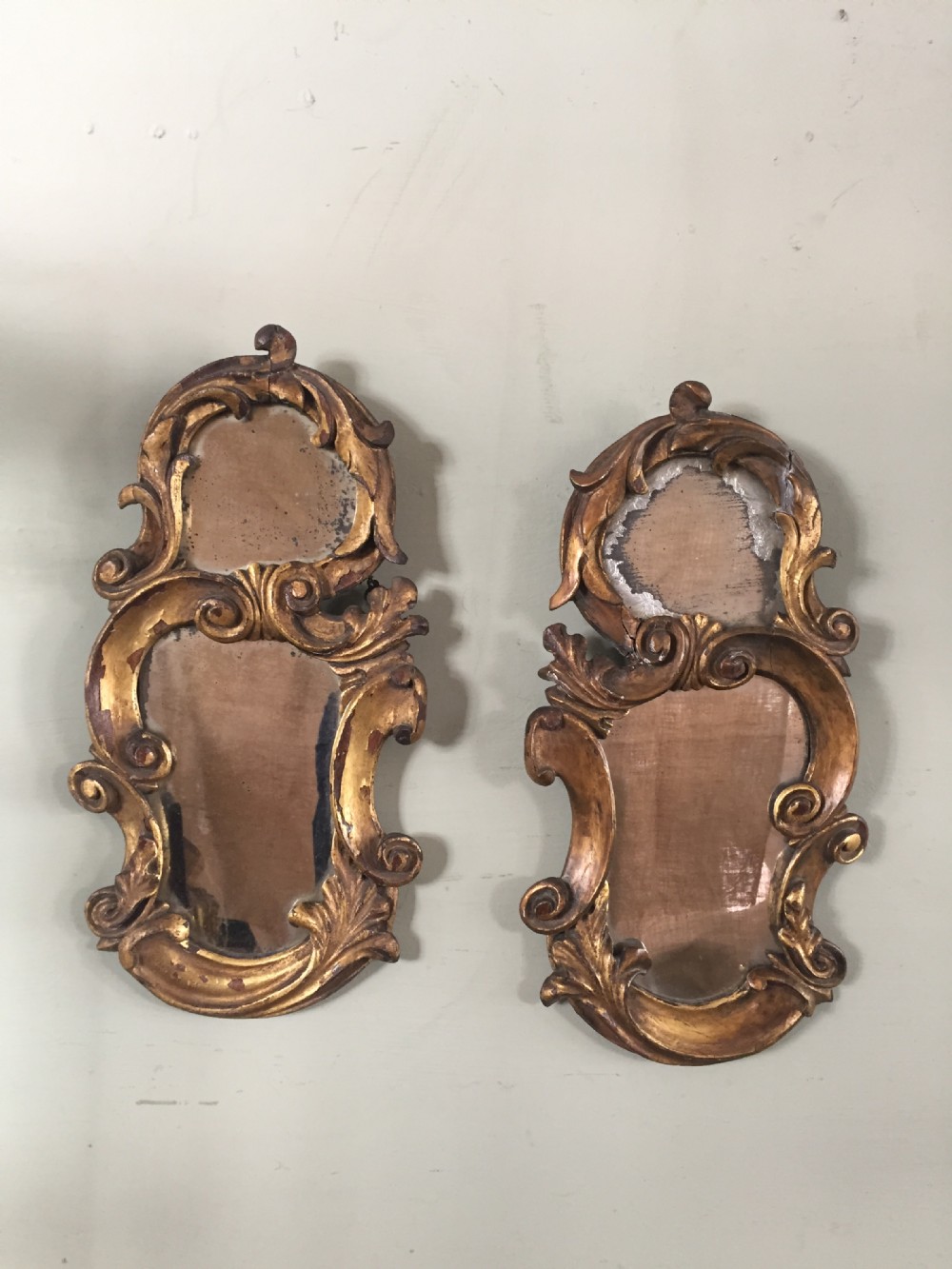 A very attractive pair of 18thc Florentine carved and gilded wood mirrors