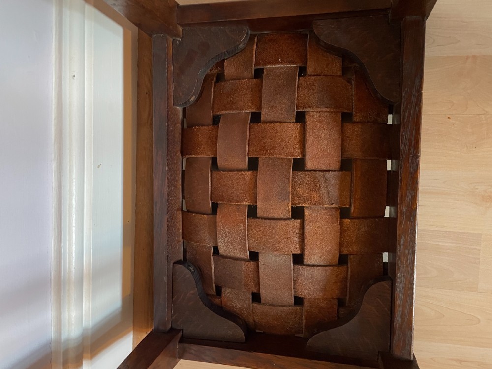 An Arts and Crafts oak and leather stool, attributed to Arthur Simpson View IV