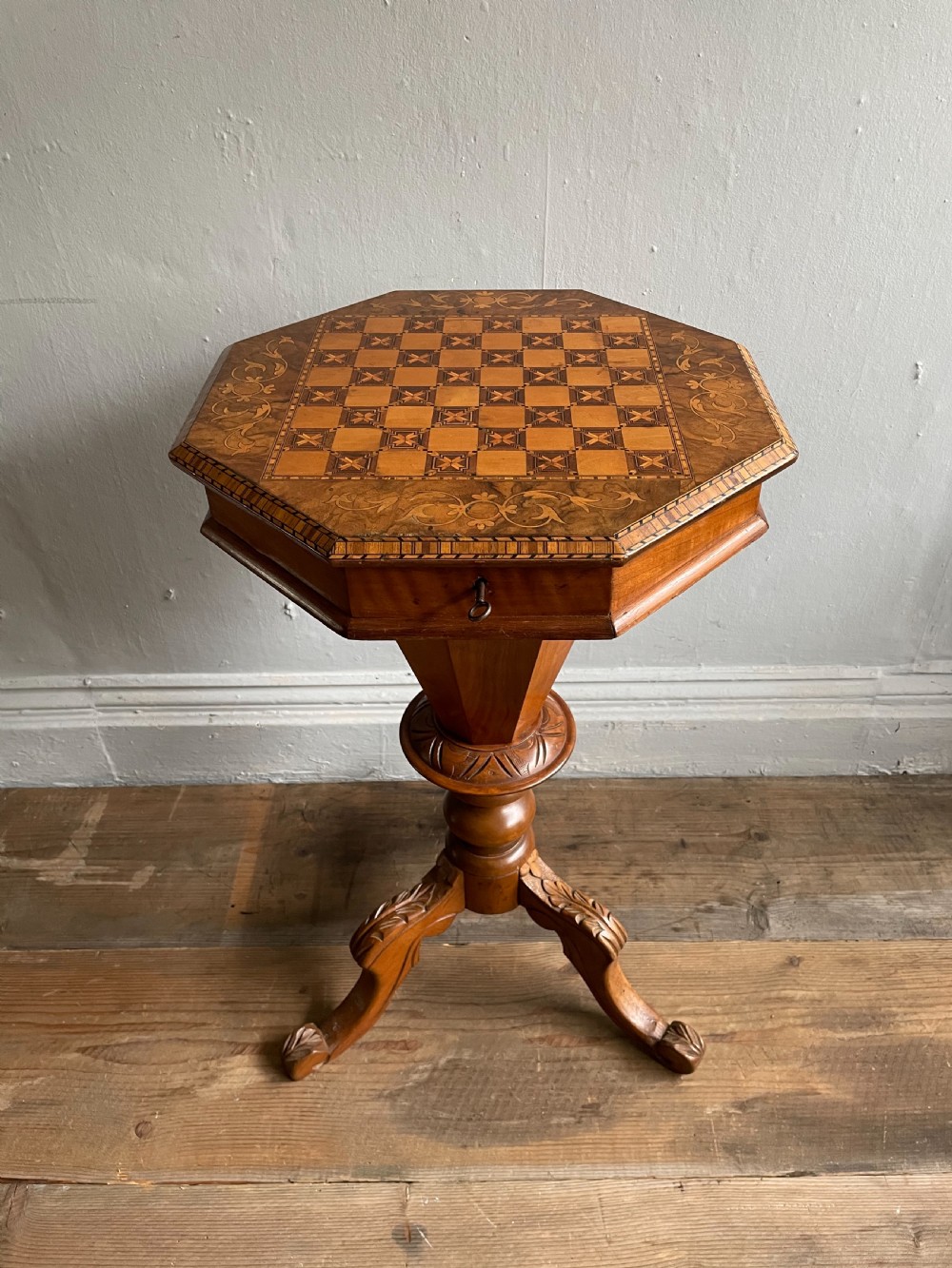 A 19thC Walnut trumpet shaped games  top worktable
