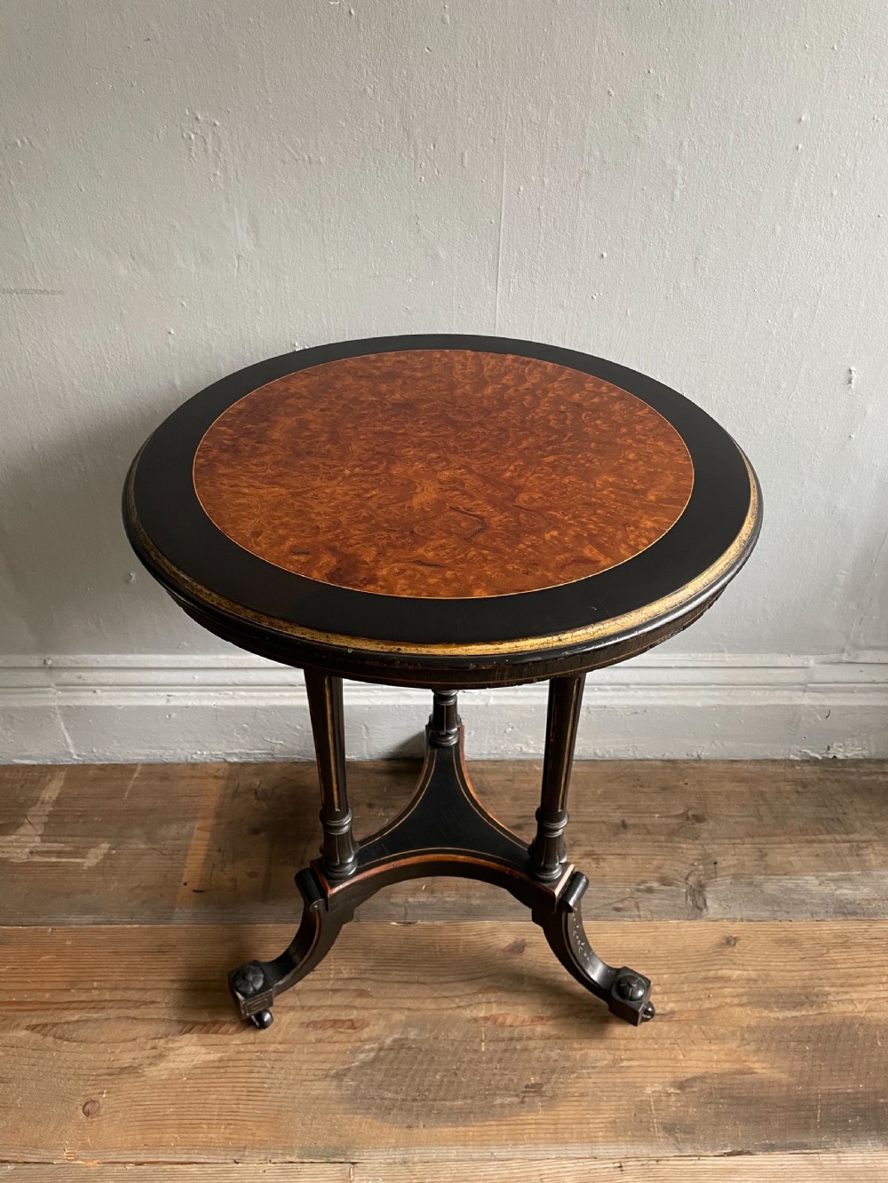 An aesthetic movement ebonised occasional table