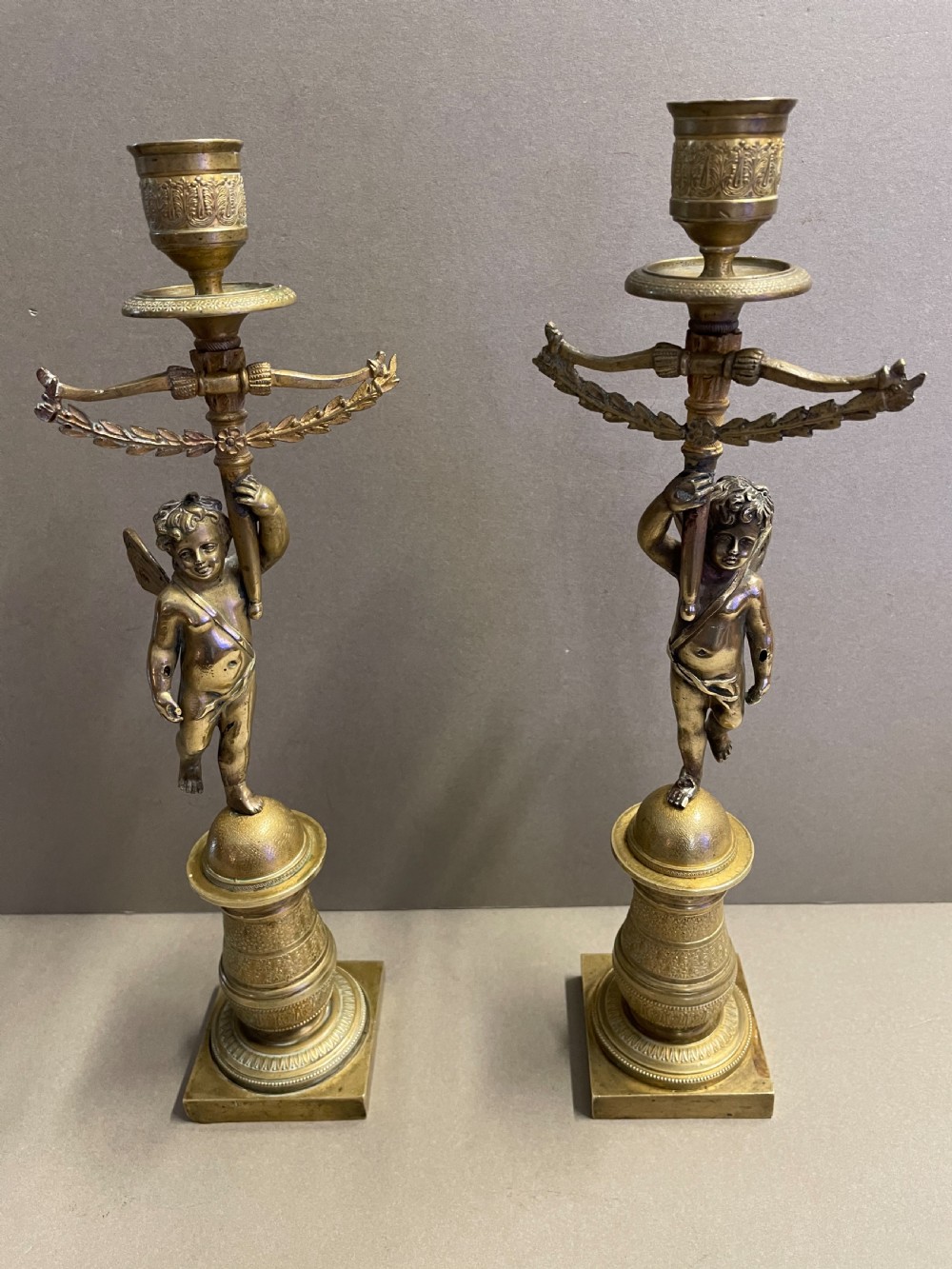 A pair of French Empire candlesticks