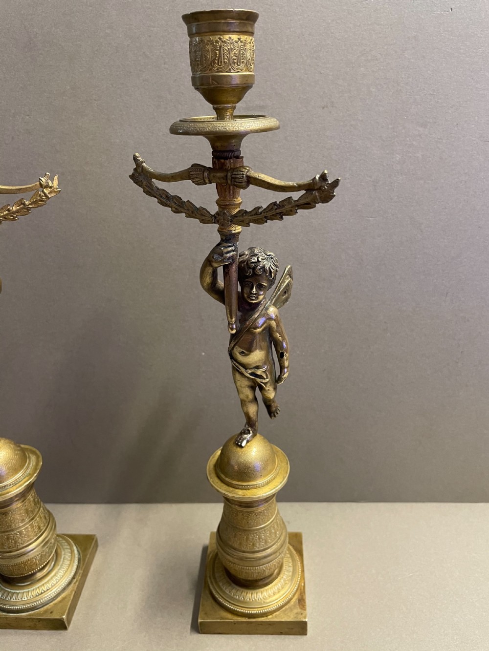 A pair of French Empire candlesticks View III
