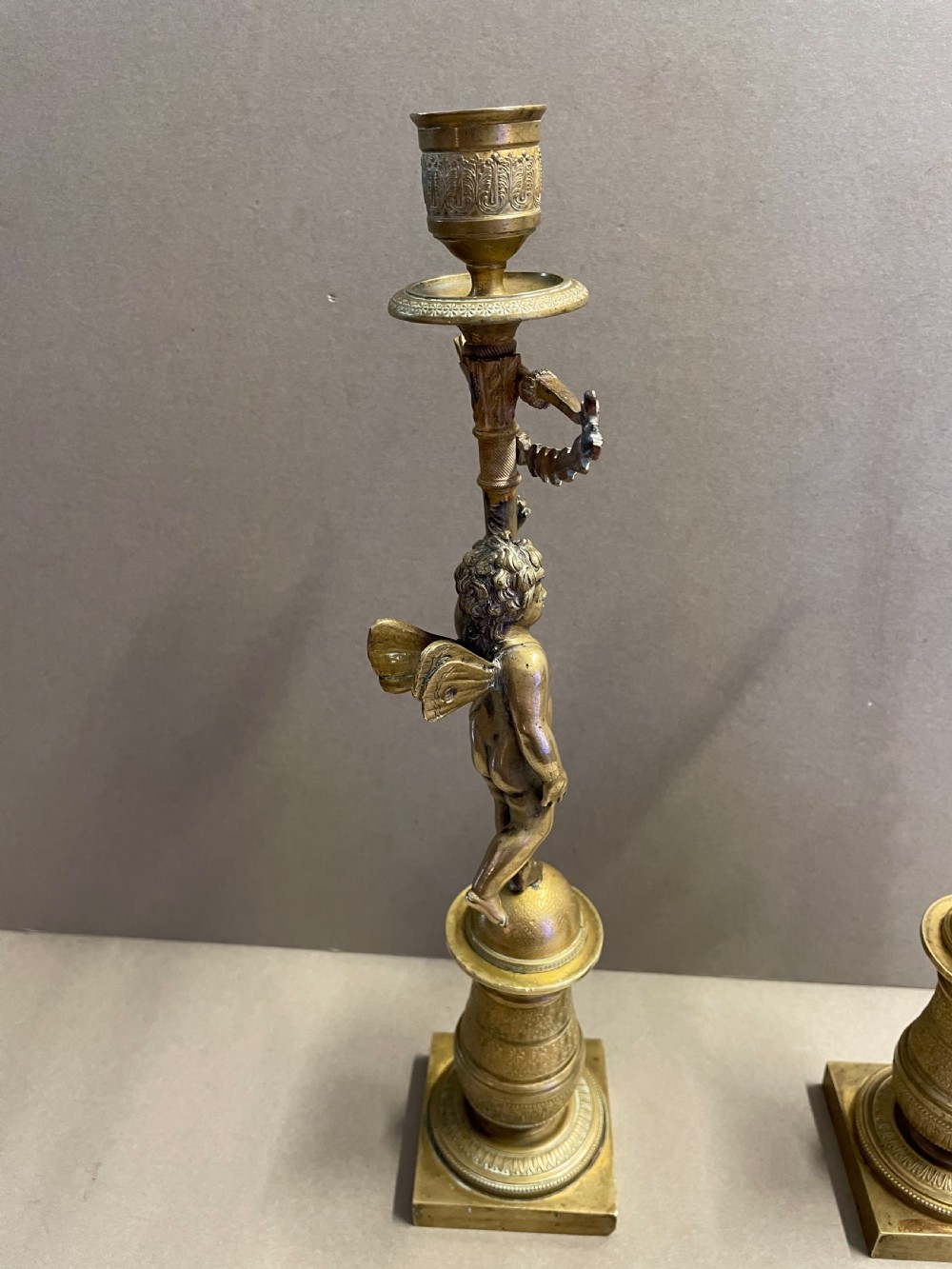 A pair of French Empire candlesticks View V