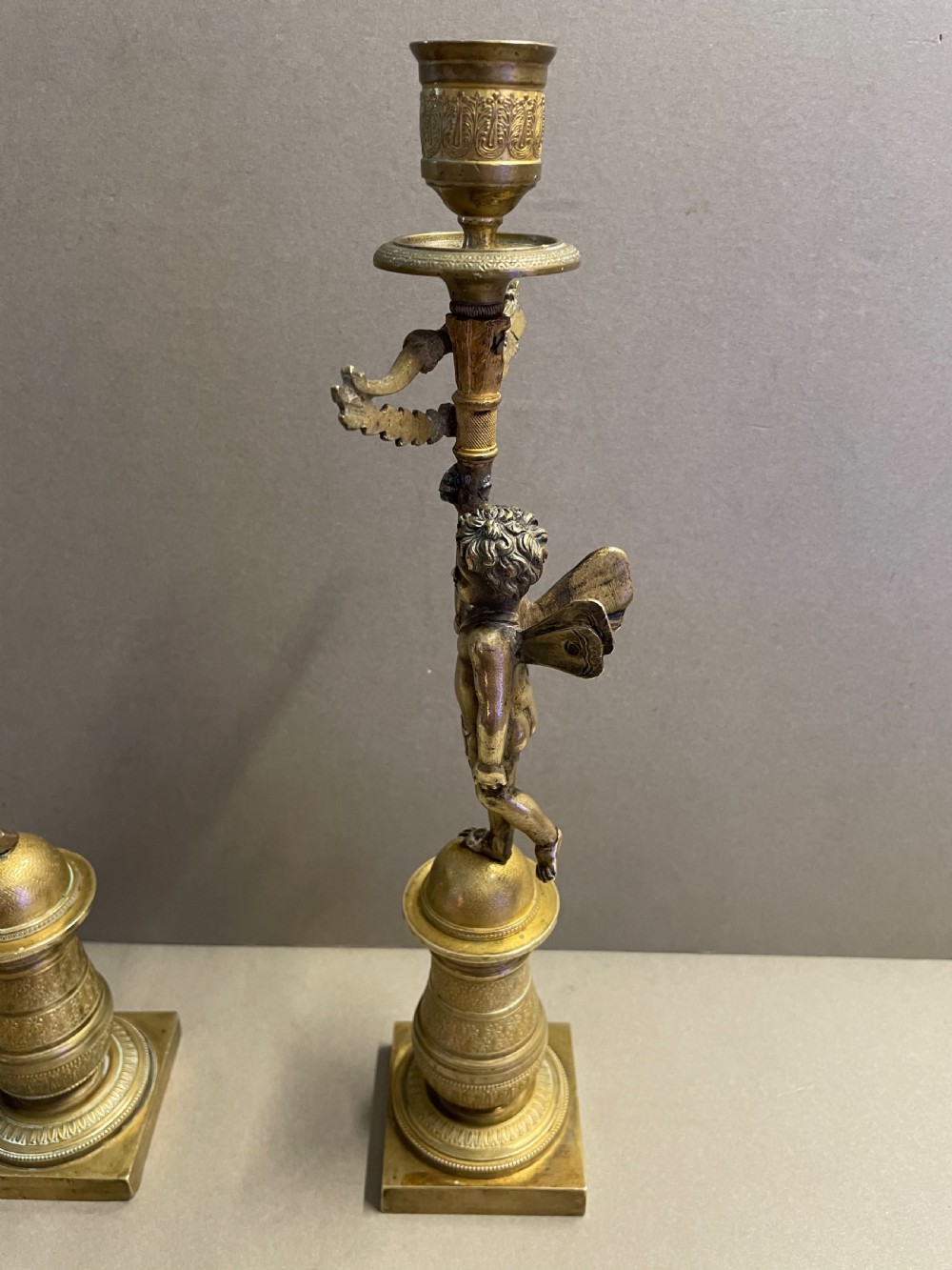 A pair of French Empire candlesticks View VI