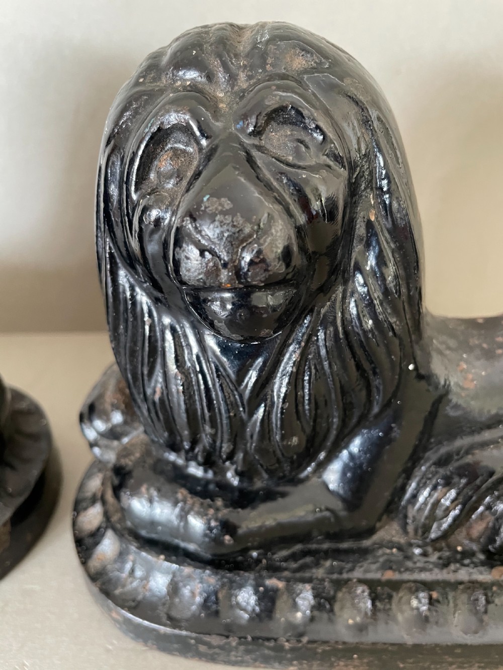 A pair of 19thC cast iron lion door porters View III