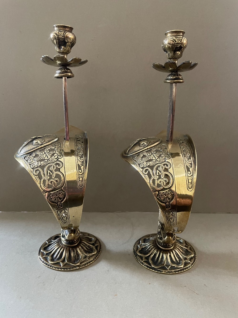 An antique pair of sword candlesticks View II