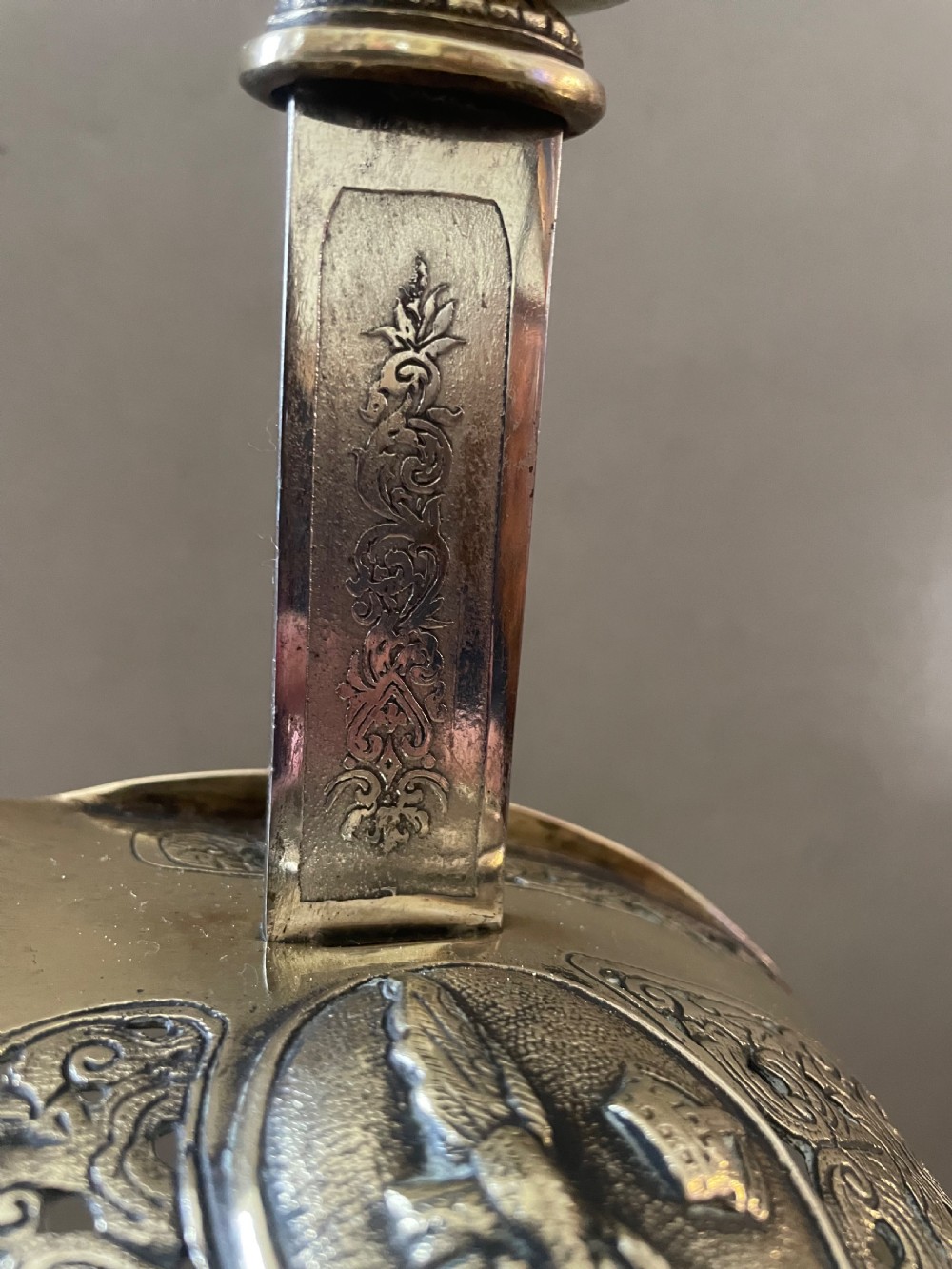 An antique pair of sword candlesticks View V
