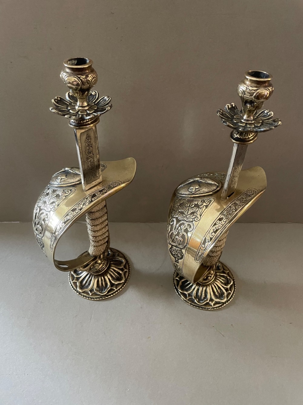 An antique pair of sword candlesticks View VII