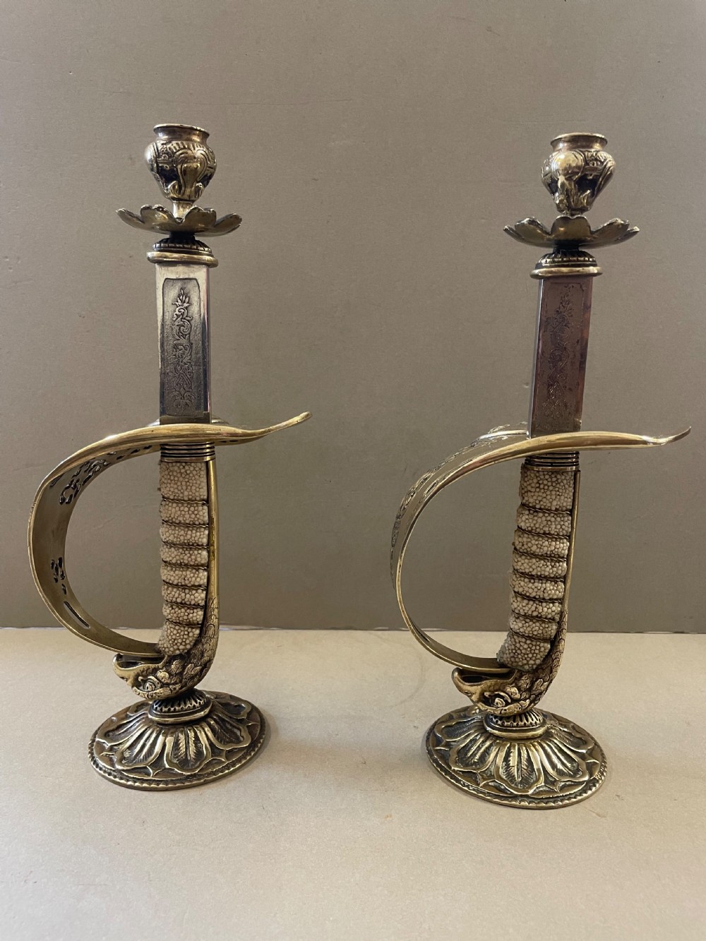 An antique pair of sword candlesticks View VIII