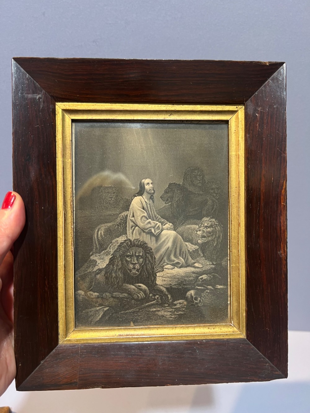 A pair of small framed antique engravings featuring religious figures set within wide dark rosewood frames with inner gilt slips. View III