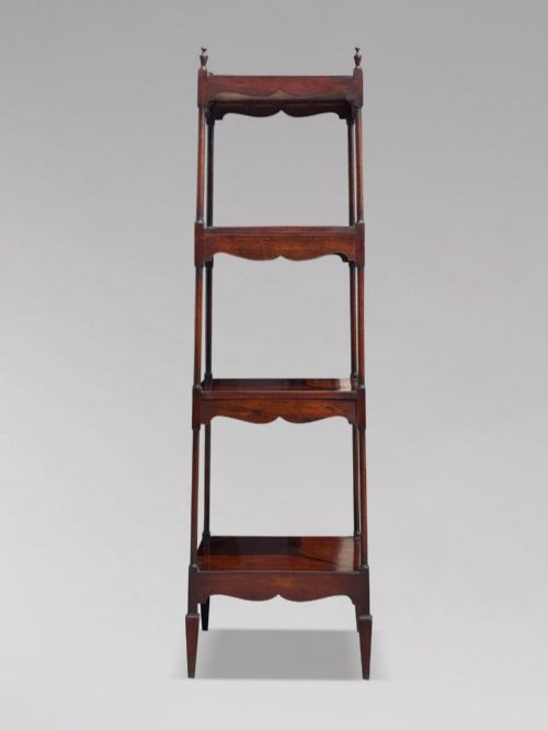 fig 1. A four-tiered George III mahogany whatnot featuring slender corner supports, turned finials, scalloped aprons, and square tapered legs.