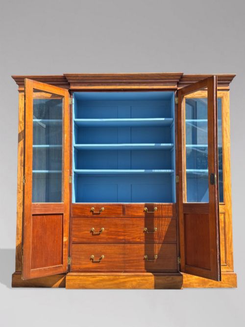 fig 2. A 19th-century French Louis Philippe walnut four-door bookcase featuring glazed upper doors, panelled lower sections, and a blue painted interior.