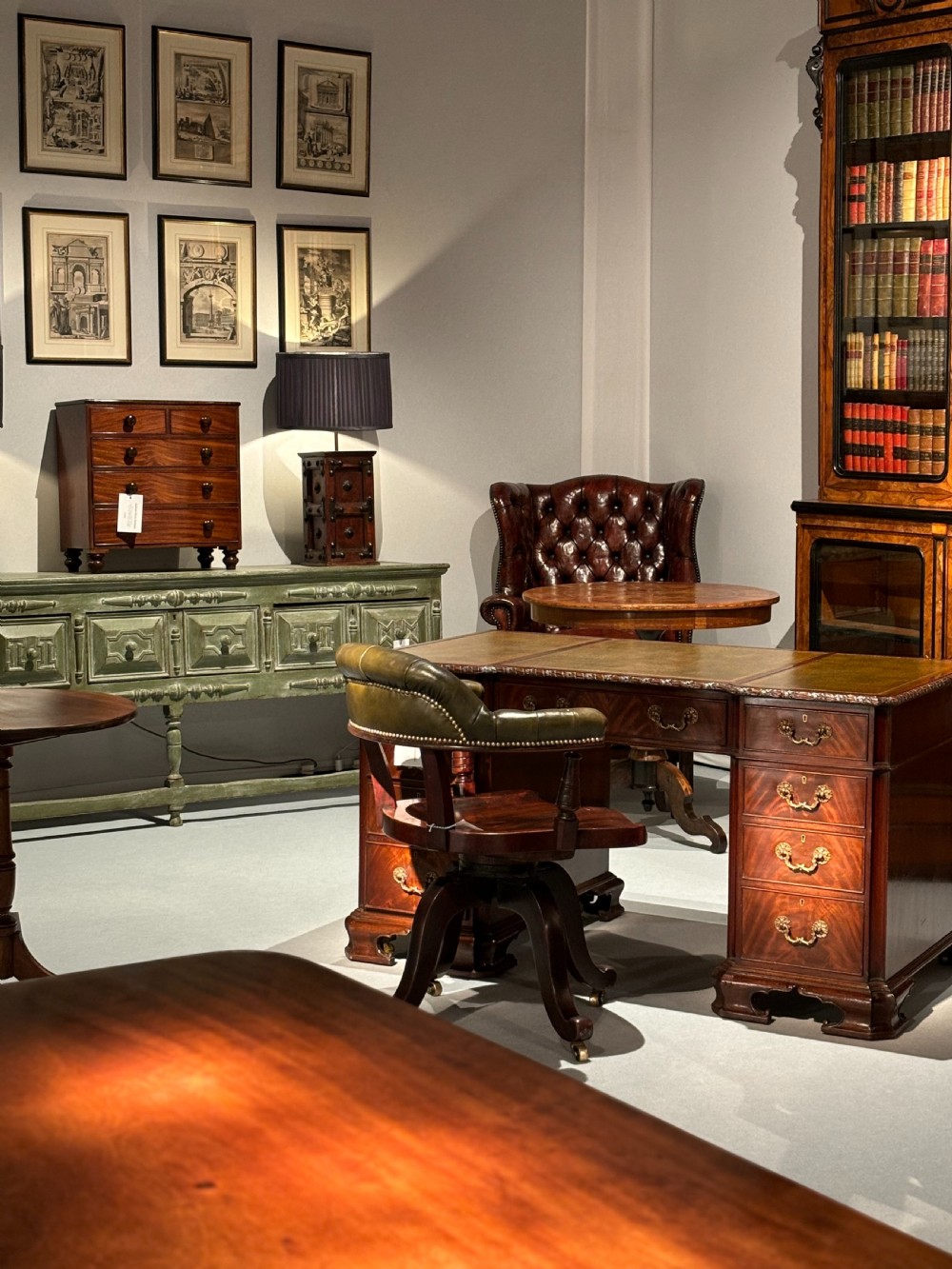 A nineteenth-century miniature mahogany bowfront chest of drawers featuring turned wooden knobs and bun feet. View VI