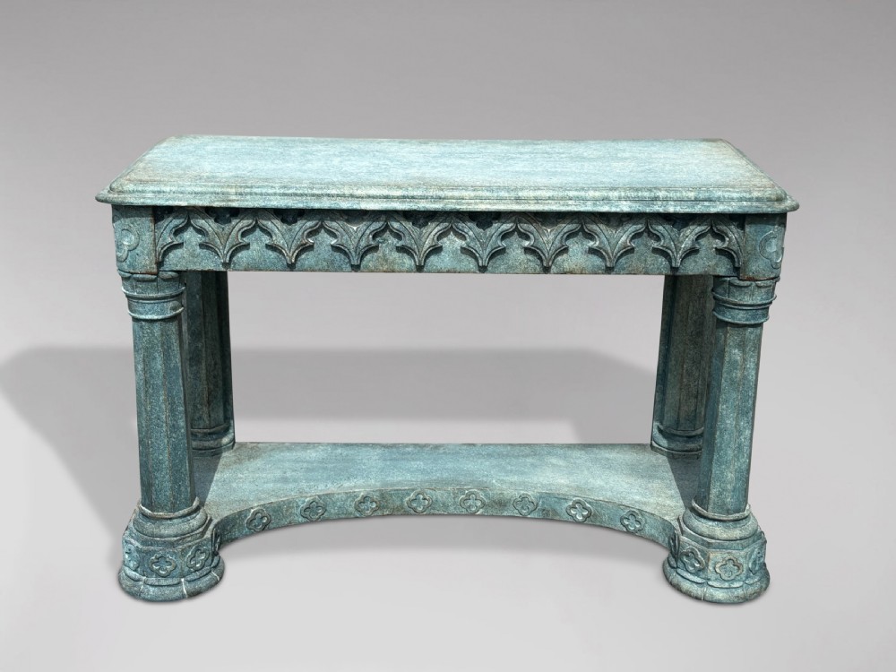 A 19th-century Gothic Revival console table with a distressed teal-green painted finish, carved tracery frieze, and column legs. View III