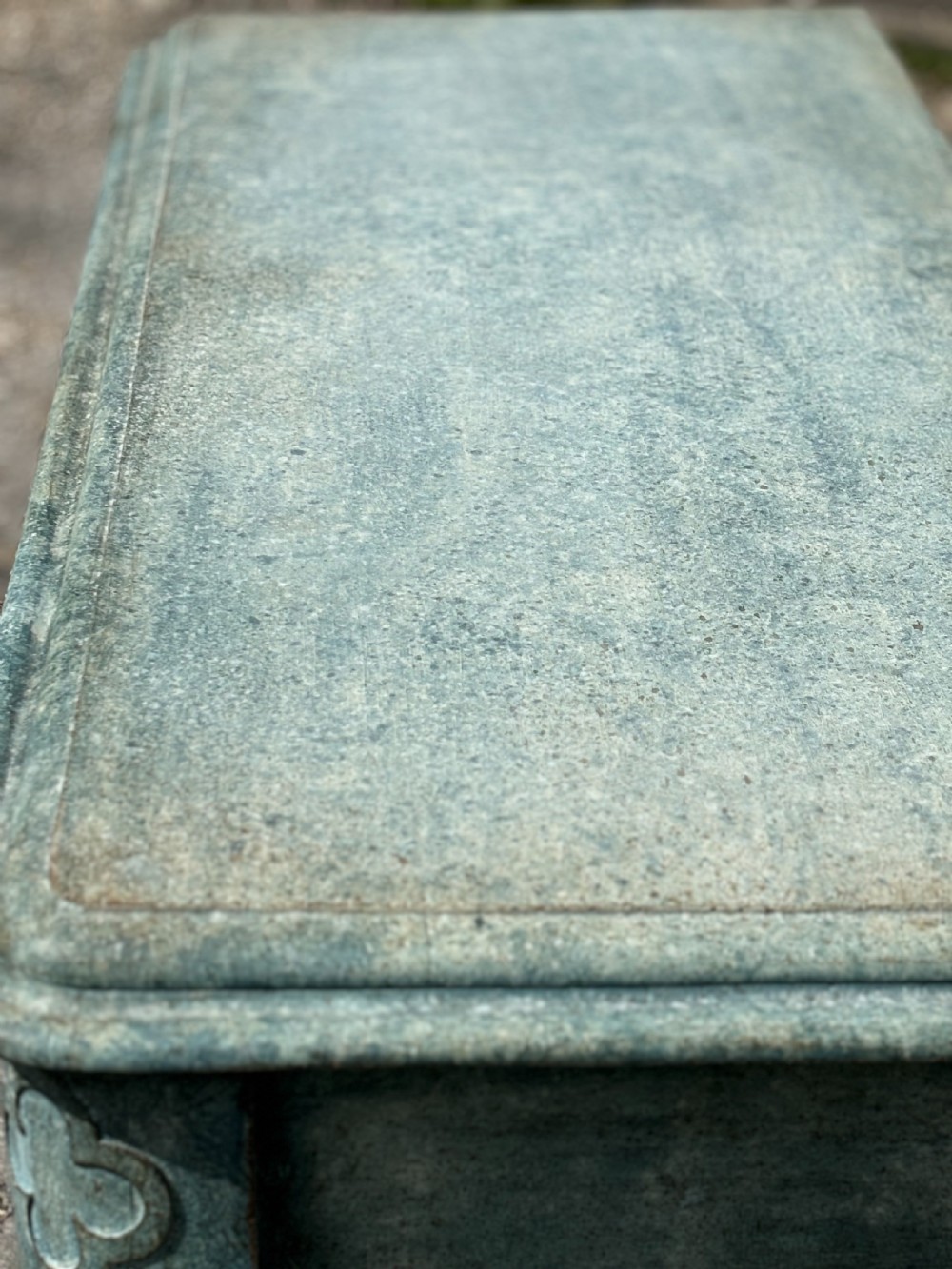 A 19th-century Gothic Revival console table with a distressed teal-green painted finish, carved tracery frieze, and column legs. View IX