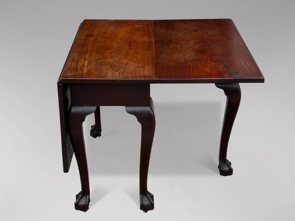 An 18th-century George II mahogany drop-leaf table featuring two hinged leaves, cabriole legs, and carved claw and ball feet. View IV