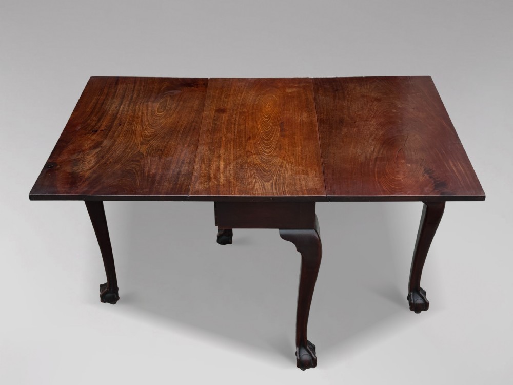 An 18th-century George II mahogany drop-leaf table featuring two hinged leaves, cabriole legs, and carved claw and ball feet. View V