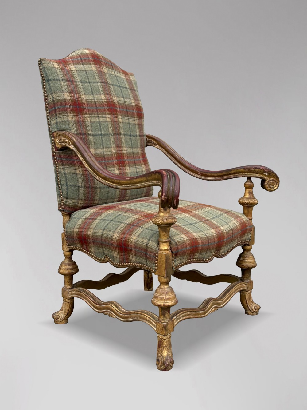 A pair of 19th-century French giltwood throne armchairs upholstered in green and red tartan plaid fabric with carved scroll arms. View IV