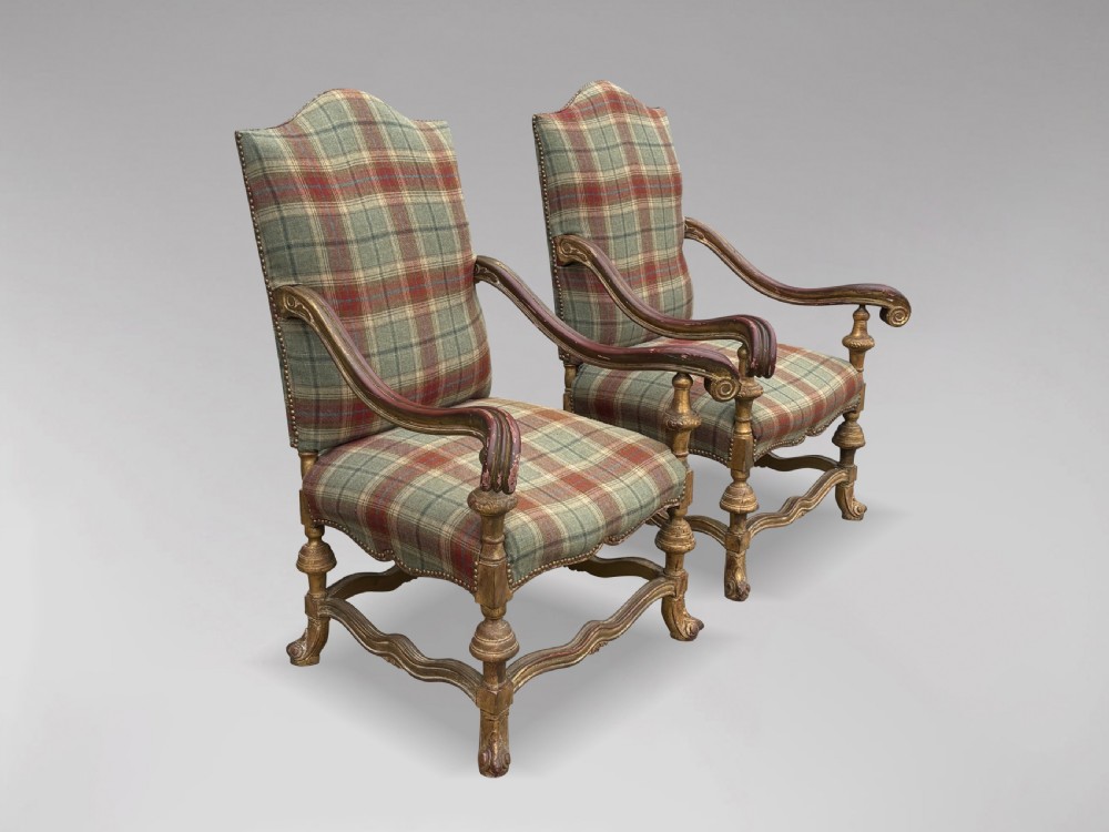 A pair of 19th-century French giltwood throne armchairs upholstered in green and red tartan plaid fabric with carved scroll arms. View VI