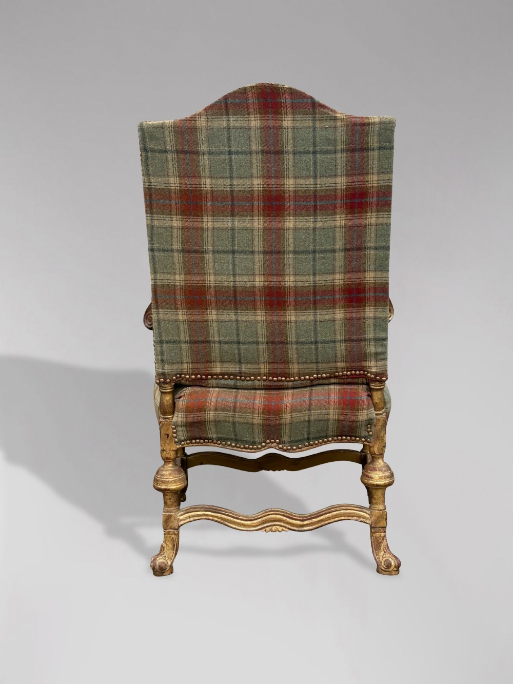A pair of 19th-century French giltwood throne armchairs upholstered in green and red tartan plaid fabric with carved scroll arms. View VIII
