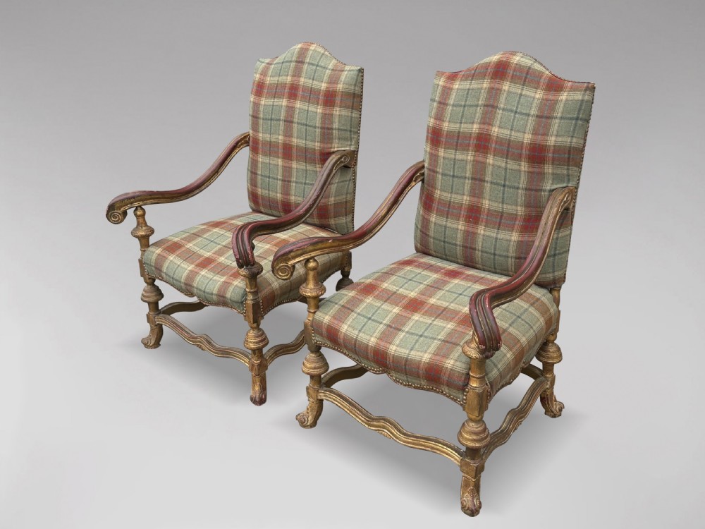 A pair of 19th-century French giltwood throne armchairs upholstered in green and red tartan plaid fabric with carved scroll arms. View XI