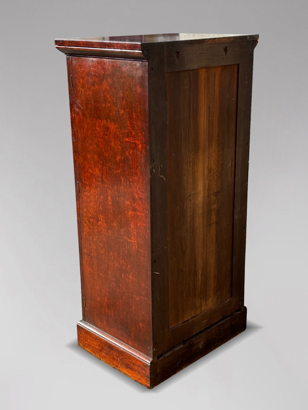A tall 19th-century Georgian mahogany Wellington chest featuring seven graduated drawers with turned knobs and a hinged side locking flap. View VII