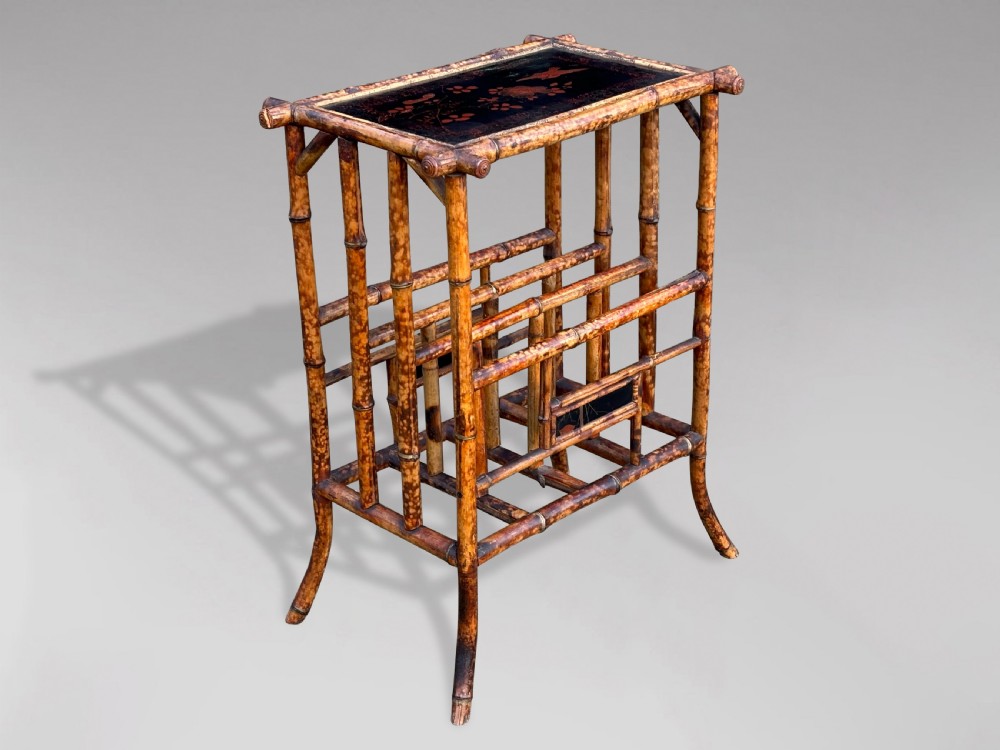 A late 19th-century tiger bamboo side table with a hand-painted lacquered top and integrated lower magazine rack dividers.