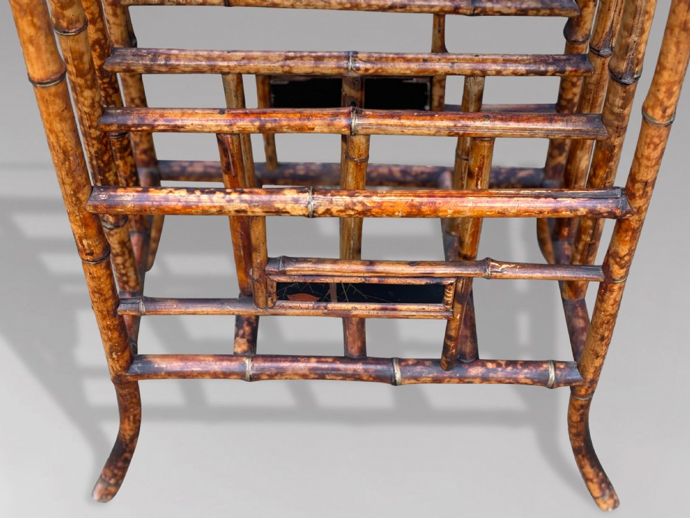 A late 19th-century tiger bamboo side table with a hand-painted lacquered top and integrated lower magazine rack dividers. View V