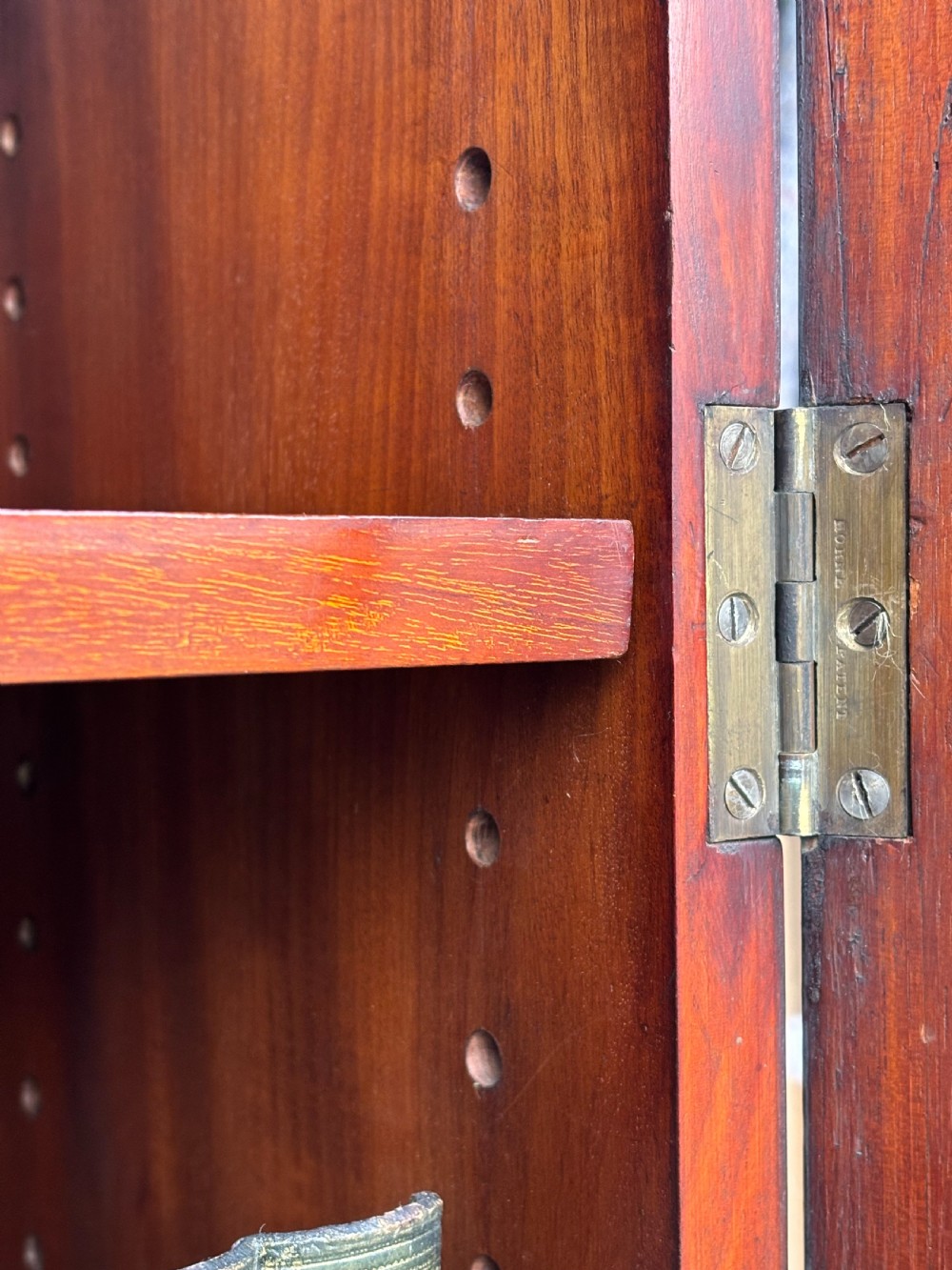 A large mid-nineteenth-century mahogany breakfront library bookcase featuring glazed upper doors, panelled lower cupboard doors, and a stepped moulded cornice. View VII